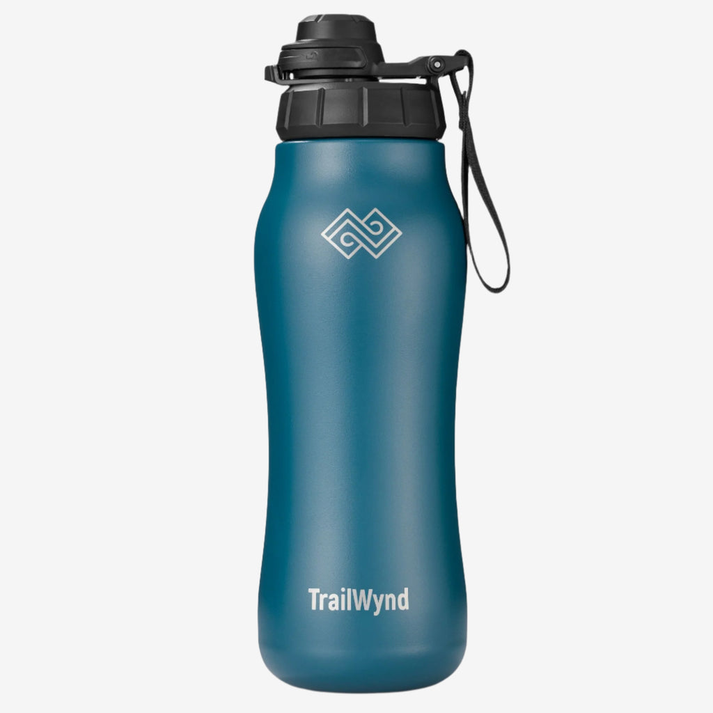 Blue water bottle with black lid and TrailWynd logo on a white background