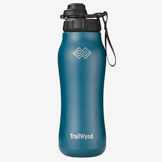 Blue water bottle with black lid and TrailWynd logo on a white background