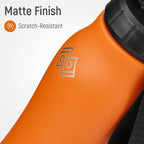 Orange object with a black lid and scratch-resistant feature label on a white background